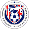 This image is a badge or emblem featuring a soccer ball and an eagle with the US and UK flags, symbolizing an international soccer/football academy.